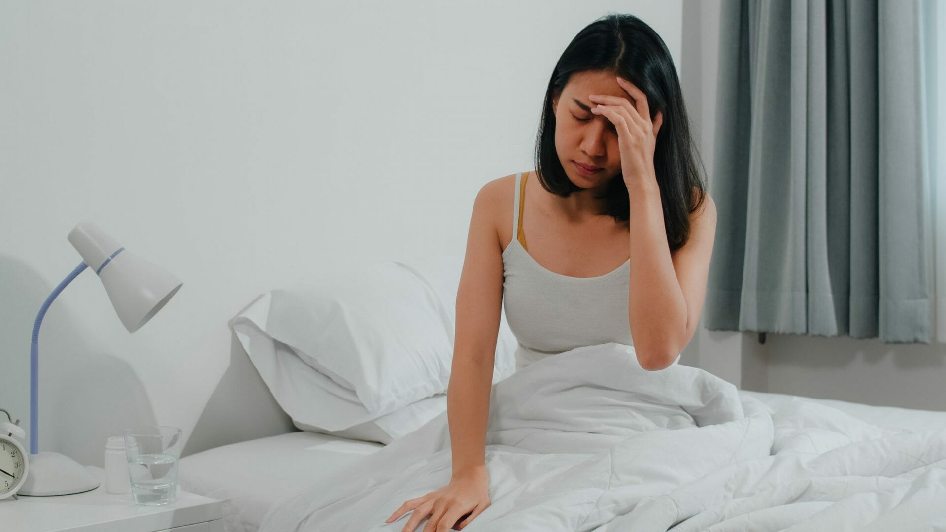 Unhealthy sick Indian female suffers from insomnia. Asian young